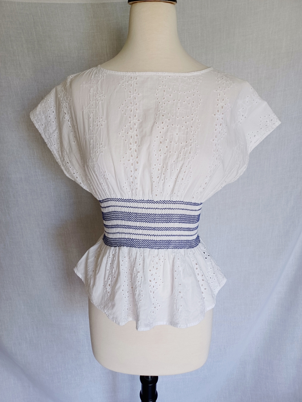 White Eyelet Peplum Blouse with Navy Waistband